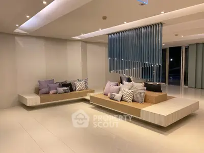 Modern living room with stylish seating and elegant decor