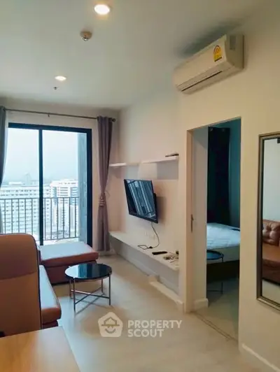 Modern living room with balcony view in high-rise apartment