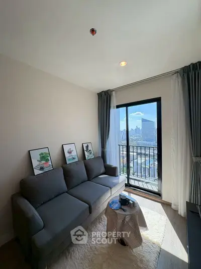 Modern living room with city view, cozy sofa, and stylish decor