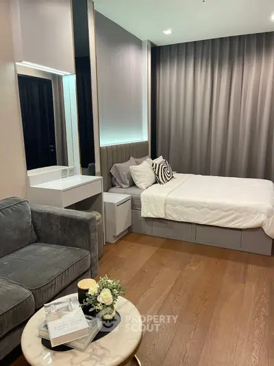 Luxurious modern bedroom with elegant decor and cozy ambiance, featuring plush bed and stylish furniture.