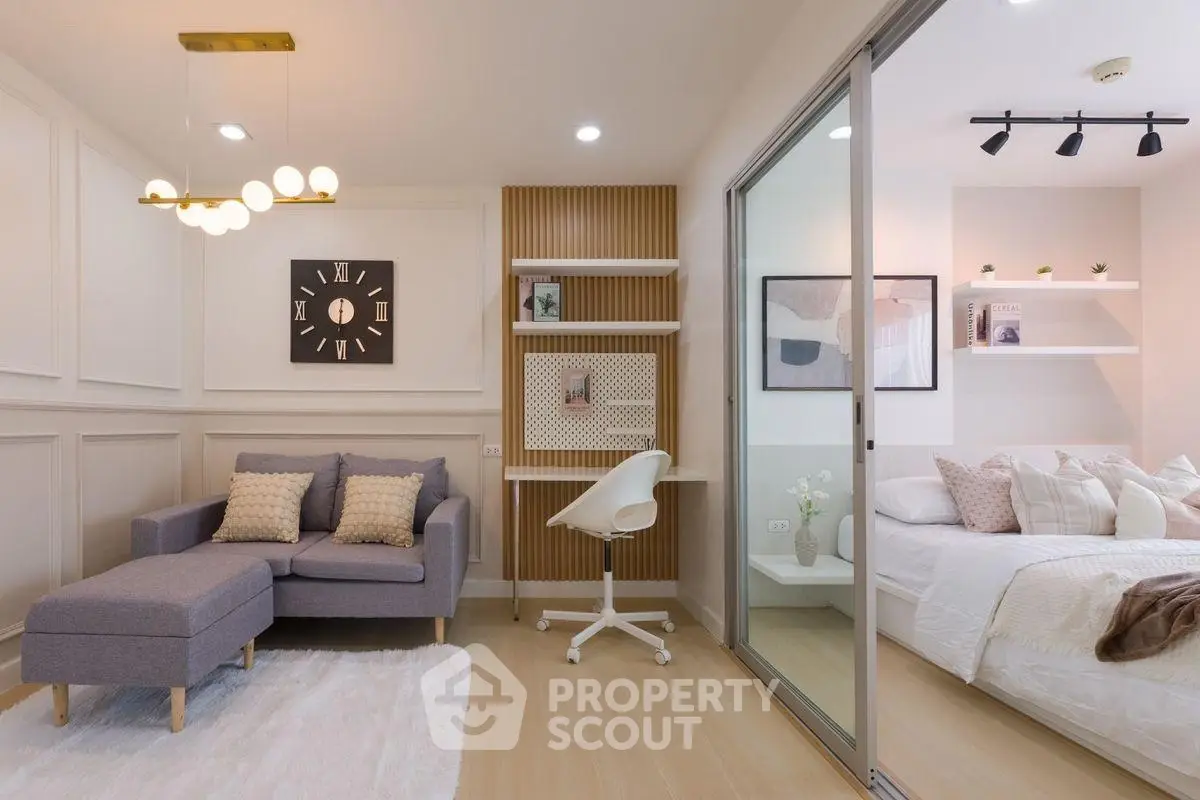 Modern studio apartment with stylish living area and cozy bedroom