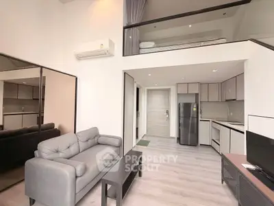 Modern loft apartment with open layout, stylish furniture, and sleek kitchen design.