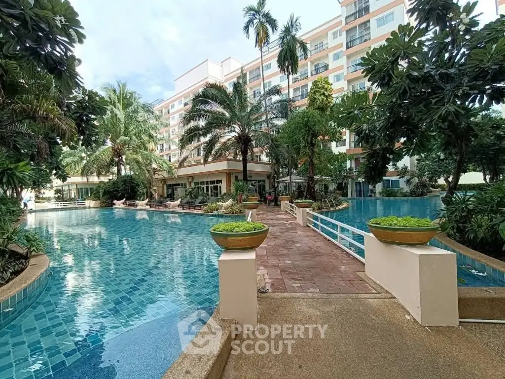 Luxurious residential complex with stunning pool and lush greenery, perfect for relaxation and leisure.