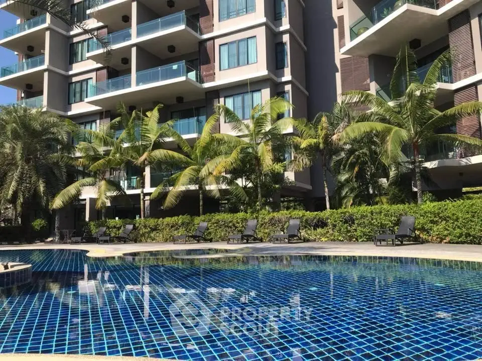 Luxurious condominium with stunning pool and lush greenery