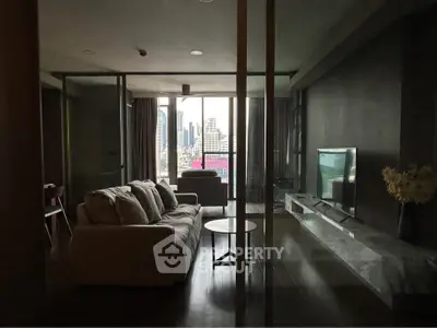 Luxurious living room with city view, modern furniture, and sleek design in high-rise apartment.