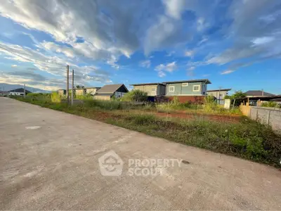 Scenic view of suburban homes under a vibrant sky, showcasing potential real estate opportunities.