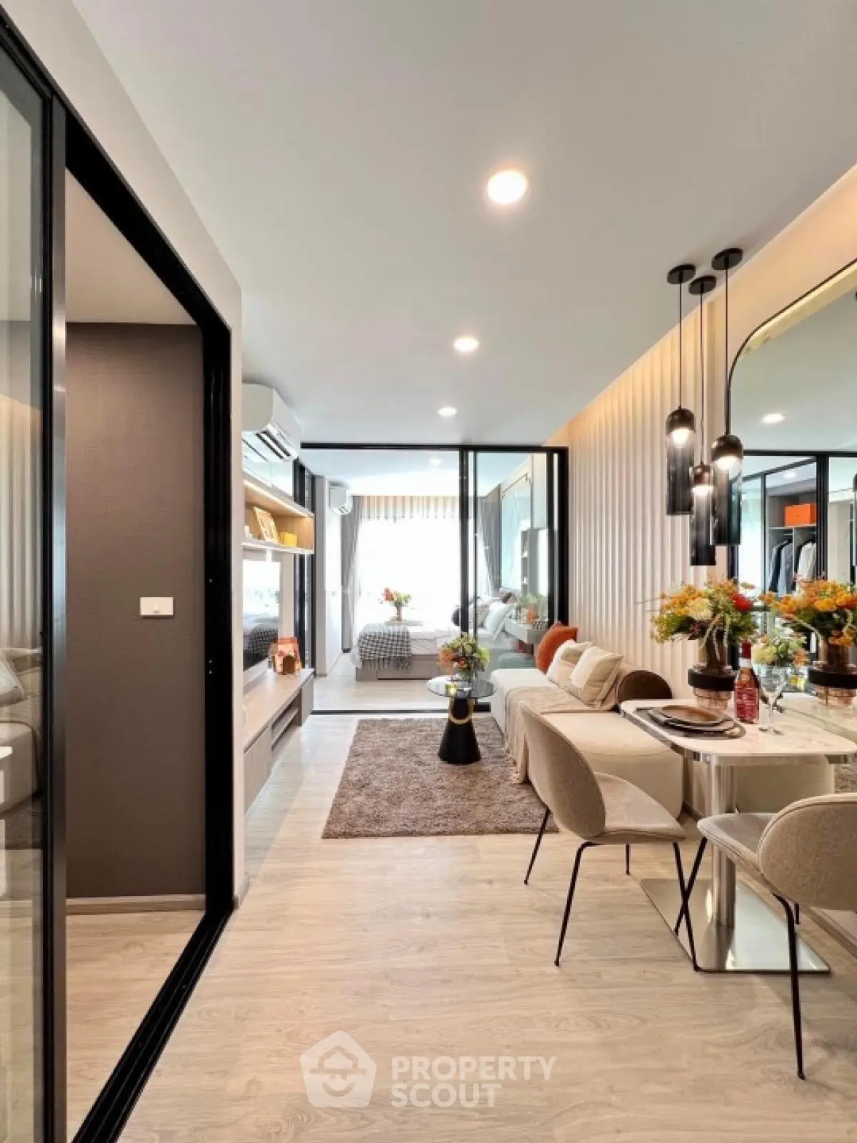 Modern open-plan living and dining area with stylish decor and natural light.