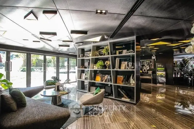 Luxurious modern living room with sleek design and large windows offering natural light.