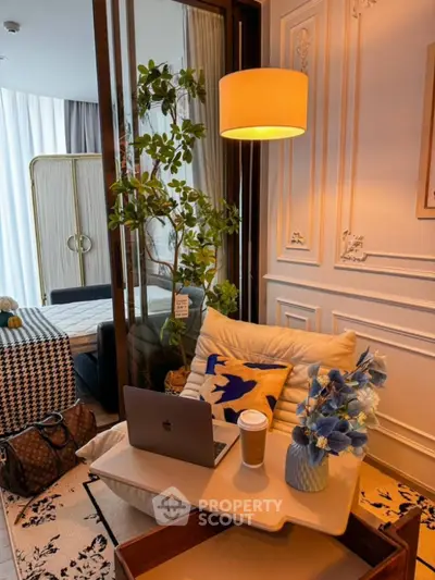 Chic modern living room with cozy seating, stylish decor, and natural light.