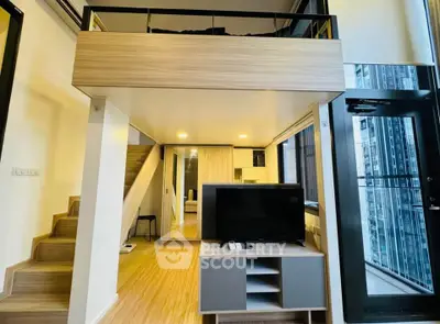 Modern loft apartment with mezzanine, large windows, and stylish wooden flooring.