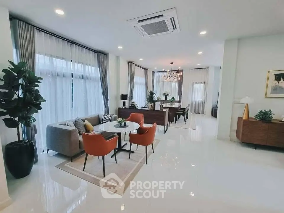 Spacious modern living room with elegant decor and ample natural light