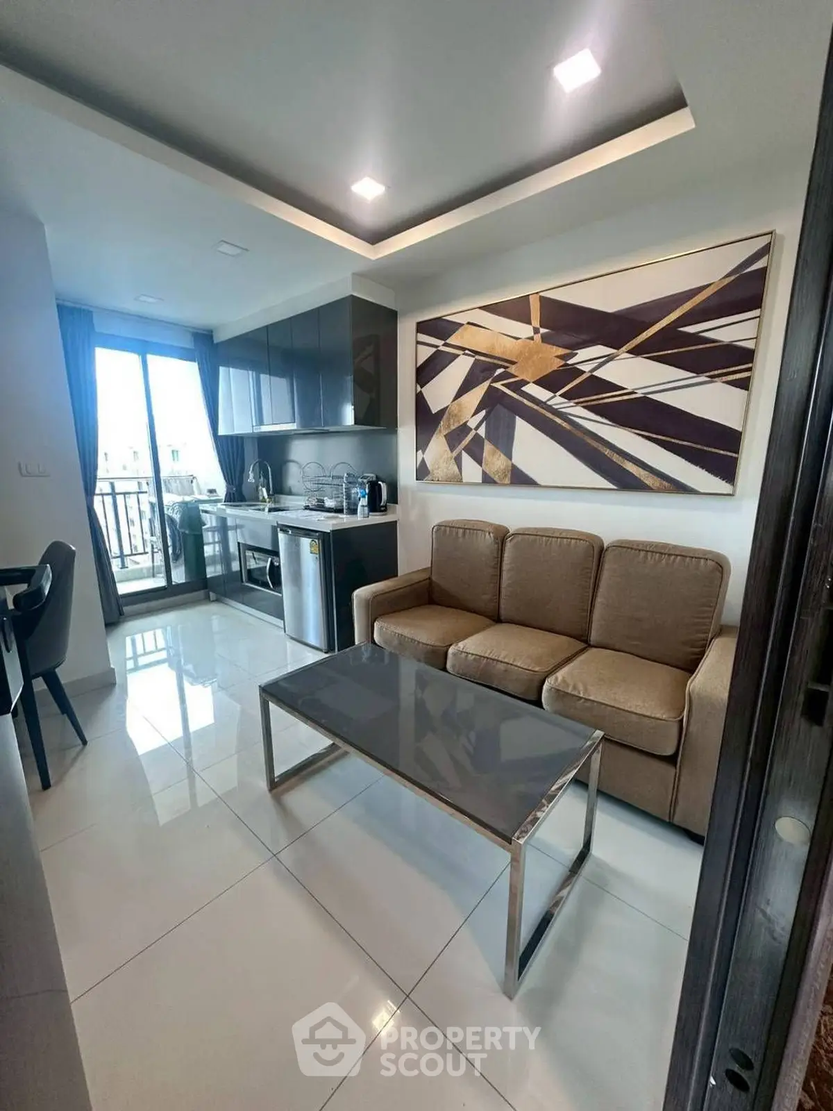 Modern living room with sleek kitchen and stylish decor in a bright apartment