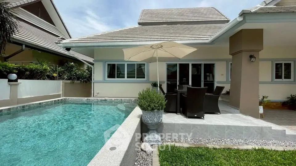 Luxurious villa with private pool and elegant patio, perfect for outdoor relaxation.