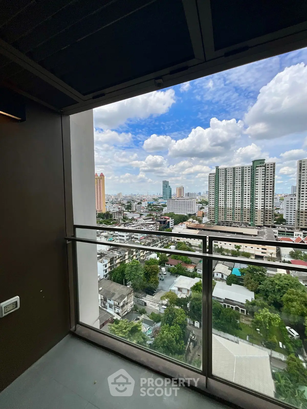 Stunning cityscape view from a modern high-rise balcony, perfect for urban living.