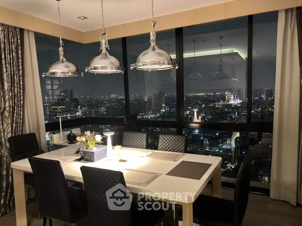 Luxurious dining room with stunning city view, featuring elegant lighting and modern decor.