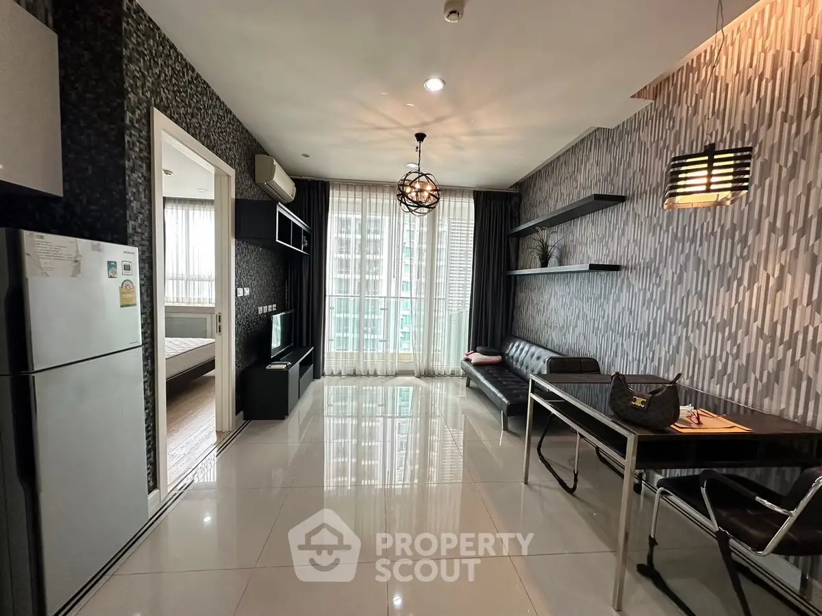 Modern living room with sleek design and open layout, featuring a dining area and large windows for natural light.