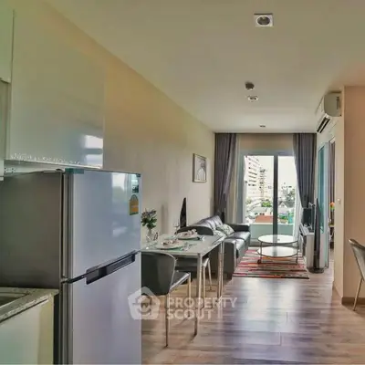 Modern open-plan living room with dining area and city view balcony