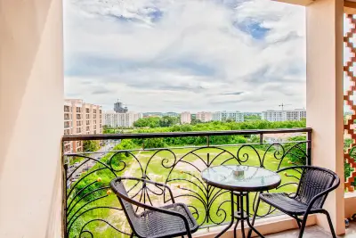 Charming balcony with stunning cityscape view, perfect for relaxation and enjoying the outdoors.
