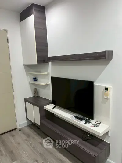 Modern living room with sleek TV unit and stylish shelving