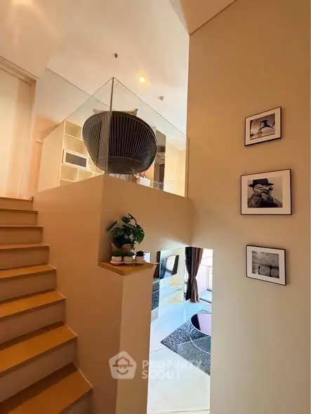 Modern duplex interior with stylish staircase and cozy living area