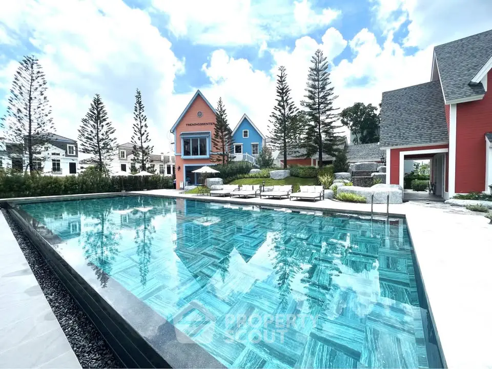 Stunning residential complex with a luxurious pool and charming architecture.