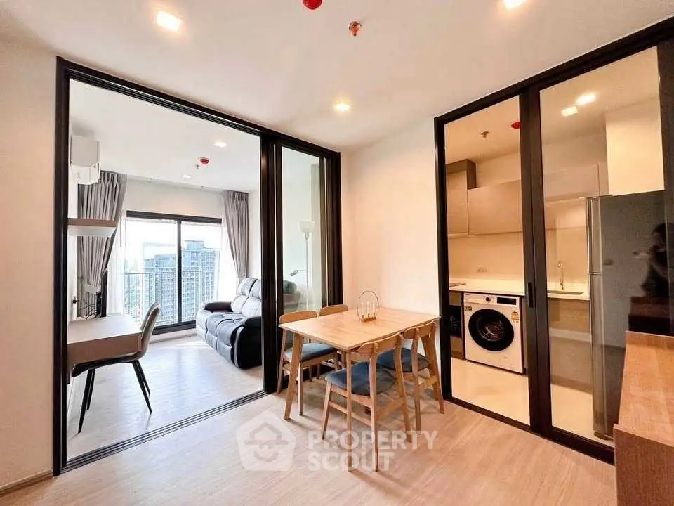 Modern apartment with open layout, featuring living room, dining area, and kitchen with city view.
