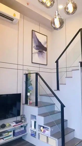 Modern duplex living room with stylish staircase and elegant decor
