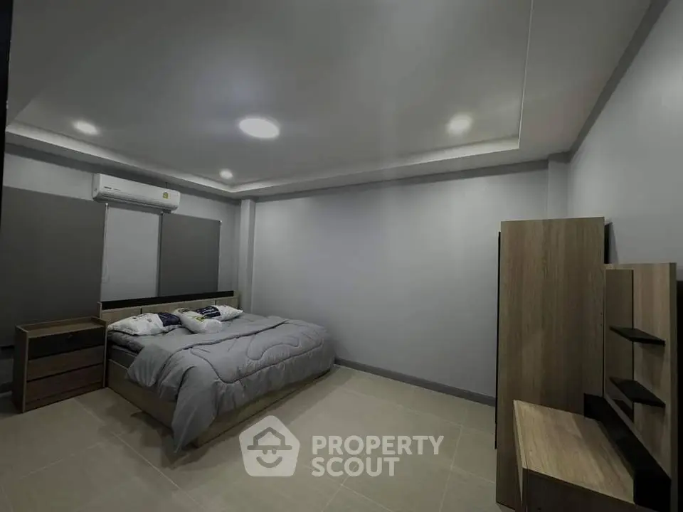 Spacious modern bedroom with minimalist design and cozy ambiance