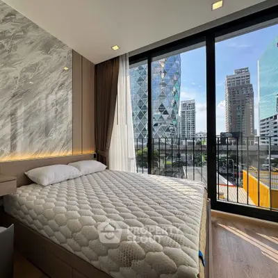 Luxurious bedroom with stunning city view and floor-to-ceiling windows in modern high-rise apartment.