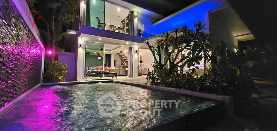 Luxurious modern villa with private pool and stylish outdoor lighting