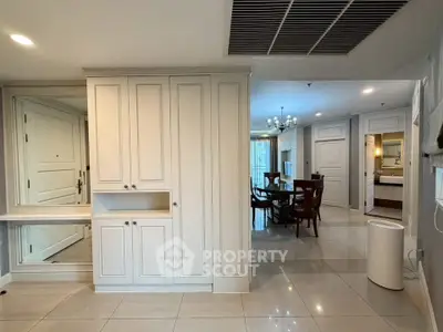 Spacious interior with elegant dining area and modern cabinetry, perfect for stylish living.