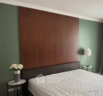 Modern bedroom with stylish wooden headboard and elegant decor