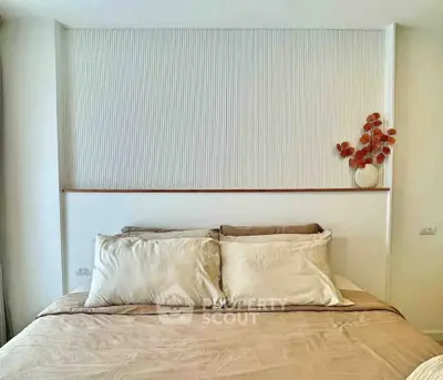 Elegant bedroom with modern decor and cozy bedding, perfect for relaxation and comfort.
