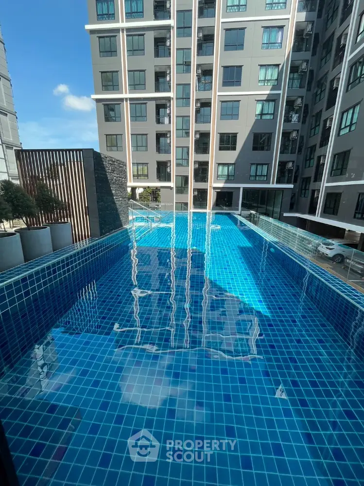 Luxurious apartment complex with stunning rooftop pool and modern architecture