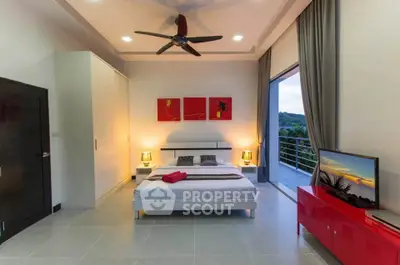 Modern bedroom with balcony and scenic view, featuring stylish decor and ample natural light.