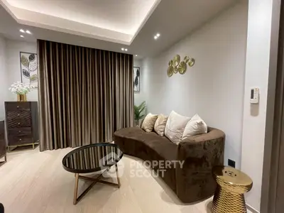 Stylish modern living room with elegant brown sofa and chic decor