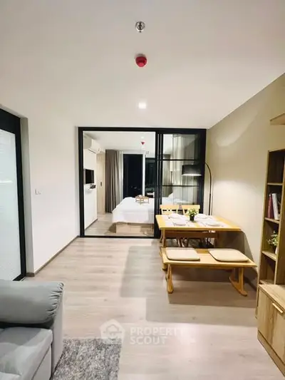 Modern open-plan living and dining area with stylish furnishings and natural light.