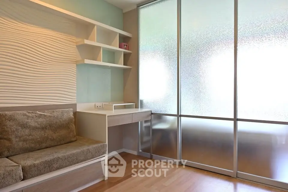 Modern study room with stylish wall design and frosted glass partition