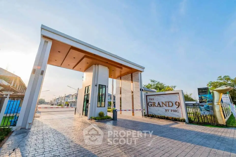 Elegant entrance of The Grand 9 by PMC with modern architectural design.