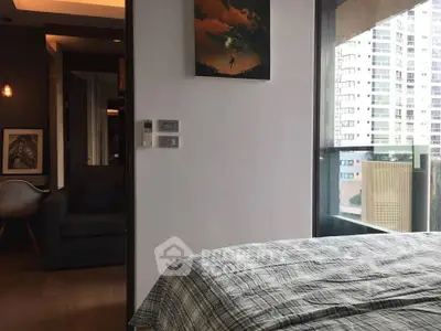 Modern bedroom with balcony view in urban apartment