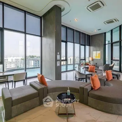 Luxurious modern living room with panoramic city views and stylish furniture.