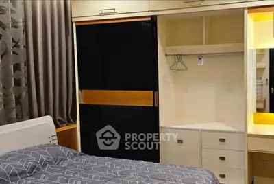 Modern bedroom with built-in wardrobe and stylish bedding
