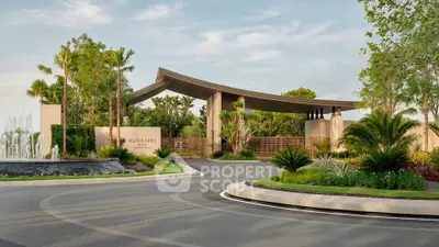 Luxurious entrance of Burasiri Well with lush landscaping and modern architecture.
