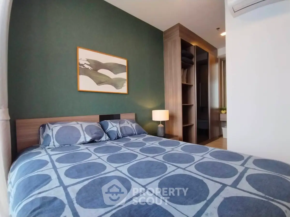 Modern bedroom with stylish decor and built-in closet