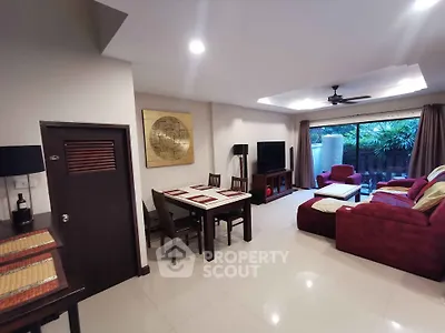 Spacious living room with modern decor and garden view