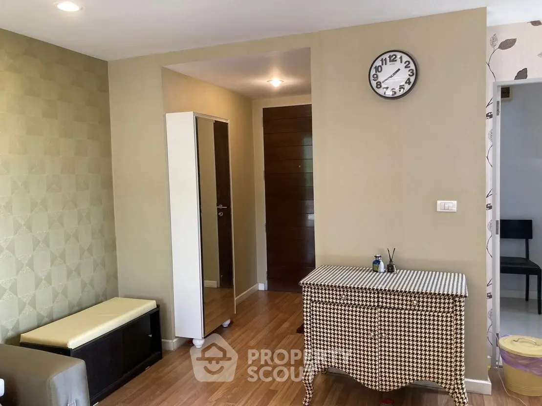 Chic modern living room with stylish furniture and wall clock