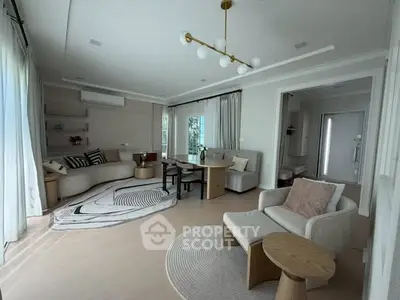 Spacious modern living room with stylish decor and natural light