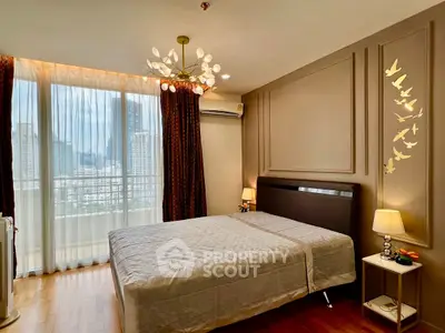 Elegant bedroom with city view, modern lighting, and stylish decor.