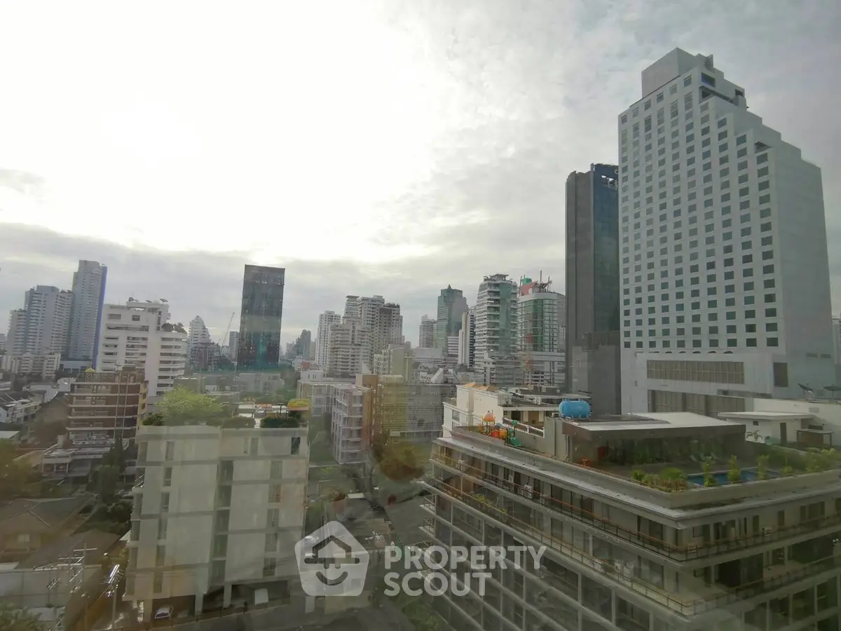 Stunning cityscape view from a high-rise building showcasing urban skyline.