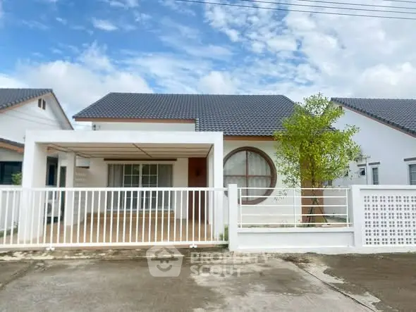 Charming single-story house with modern design and spacious front yard, perfect for family living.